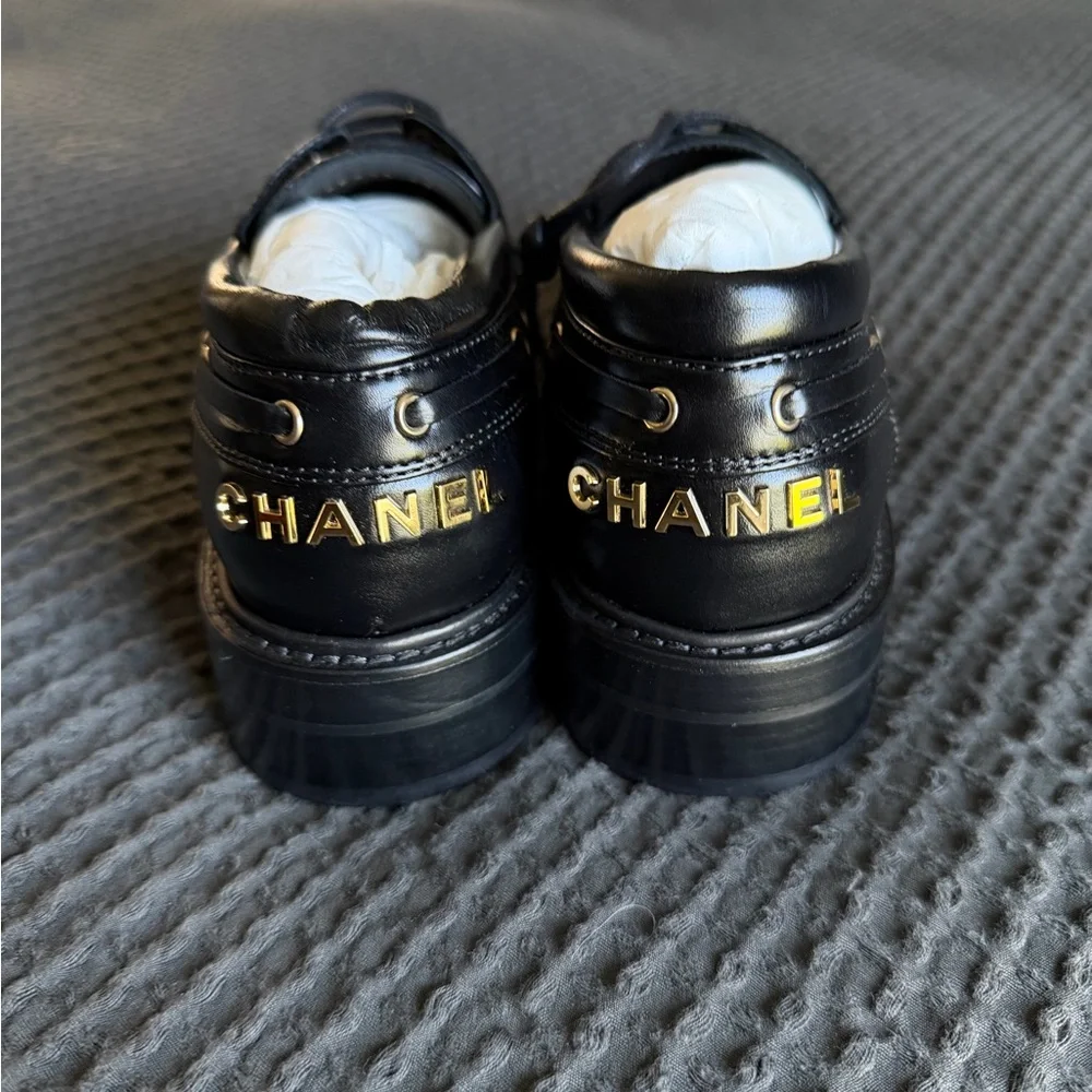 CHANEL Black Leather Women’s Shoes with Gold Accents